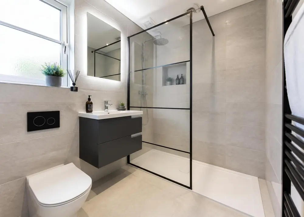 Newly renovated tiled bathroom with walk-in shower fitted in a Greater Manchester rental property