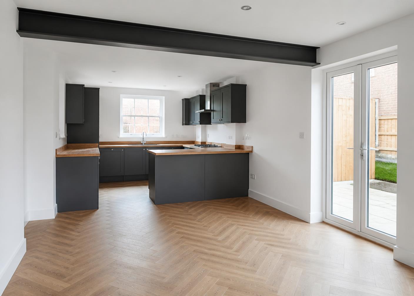 Completed open plan kitchen diner with exposed steel beam in a Manchester terraced house